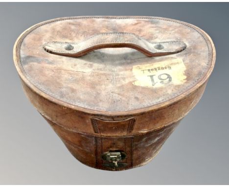 A 19th century leather top hat box initialled K. M. U. 