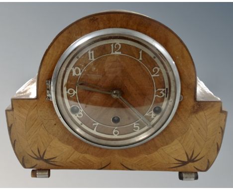 An Art Deco walnut 8 day mantel clock.