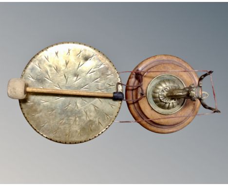 A vintage brass dinner gong with beater mounted on a brass stag's head plaque 