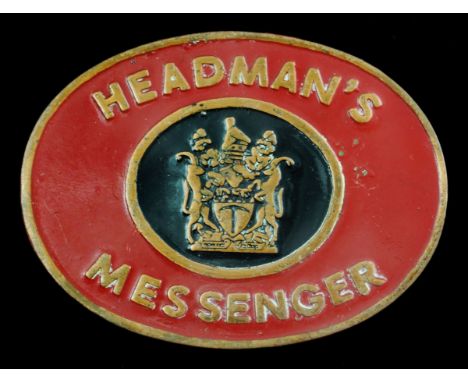 A Rhodesian Headman's Messenger Badge of OfficeBrass plate with lettering 'HEADMAN'S MESSENGER' surrounding the Arms, upon a 