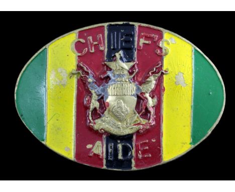 An Rhodesian Chief's Aide Badge of OfficeBrass with enamelled ground, the Arms of Rhodesia and legend 'CHIEF'S AIDE', lugs to