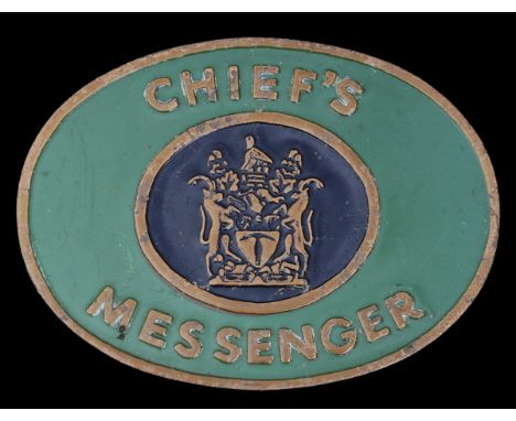 A Rhodesian Chief's Messenger Badge of OfficeBrass plate with lettering 'CHIEF'S MESSENGER' surrounding the Arms, upon a blac