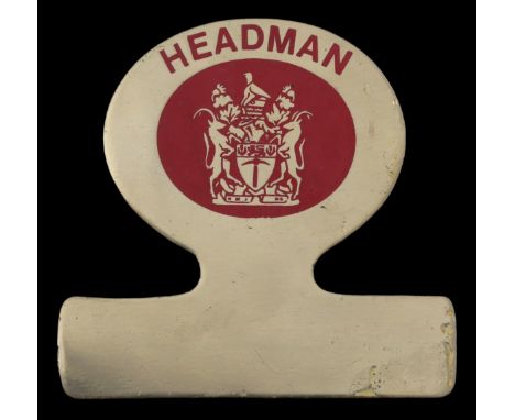 A Rhodesian Headman's Badge of OfficeBrass plate with lettering 'HEADMAN' above the Arms in red enamel, 76mm x 72mm, lugs det