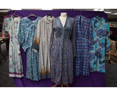 A collection of vintage and retro Ladies clothing in a mixture of colours,styles and eras including maxi dresses.