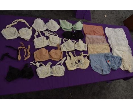A collection of ladies vintage and retro underwear and lingerie including nylon knickers and bras.
