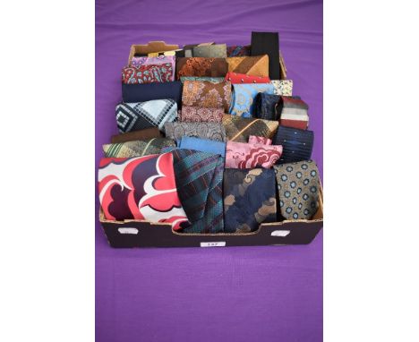 A box full of vintage gents ties, various styles and eras.