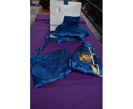 A vintage Chinese pyjama and dressing gown set in blue having gold dragon embroidery in case,around 1960s.