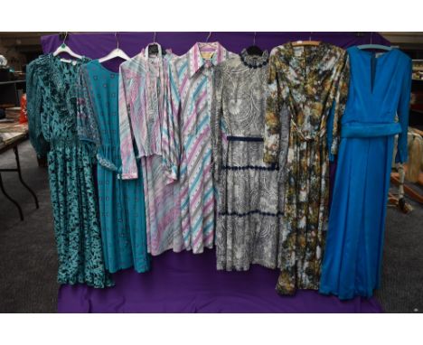 An assortment of vintage and retro Ladies clothing in a variety of colours,styles and eras including maxi dresses.