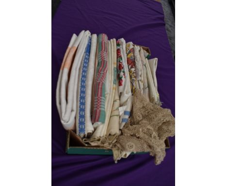 A box full of vintage table linen and similar including damask, embroidered and novelty table cloths also included are a quan