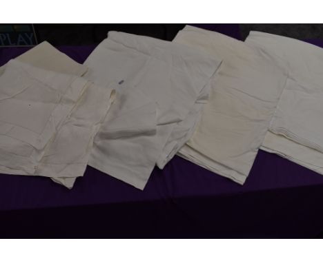 A selection of vintage white flat sheets.