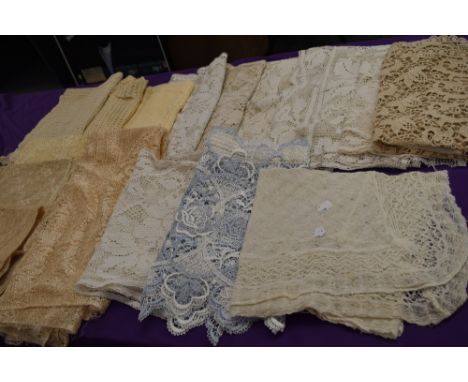 A large lot of vintage crotchet/net curtains,sections panels and settee backs.