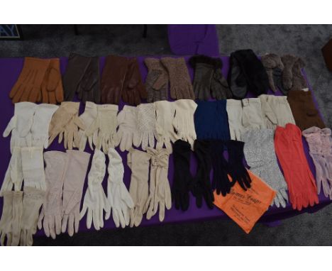 A large collection of ladies vintage gloves, various styles,lengths and colours and fabrics including some unworn pairs with 