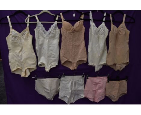 A collection of vintage corselettes and girdles.