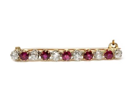 A ruby and diamond two colour bar brooch,with alternating circular mixed cut rubies and old European cut diamonds, all claw s