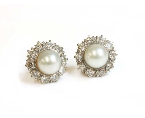 A pair of cultured pearl and diamond cluster earrings, with a 9.2mm cultured pearl, rub set to a surround of ten brilliant cu