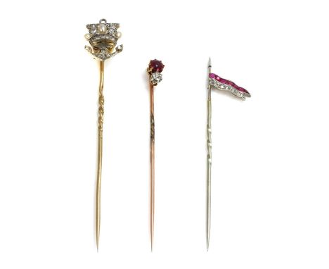 Three diamond set stick pins,to include a diamond and seed pearl naval crown and anchor, with a rose cut diamond set anchor, 