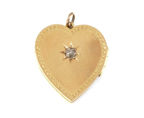 An 18ct gold diamond set heart-shaped hinged locket,by Solomon Abelman, with an old European cut diamond, star set to the cen