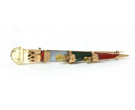 A Victorian Scottish hardstone or pebble dirk brooch, c.1870,with a faceted citrine pommel-style handle with pierced and engr