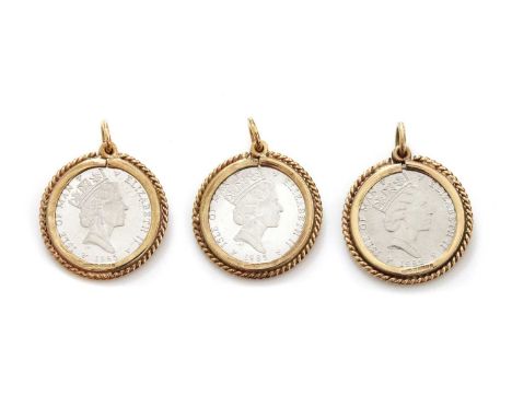 Three Isle of Man one tenth platinum coin pendants or charms, all dated 1985, each one channel set in a 9ct gold mount, with 