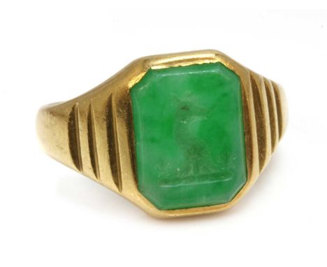 A gentlemen's 18ct gold Art Deco carved jade intaglio signet ring,with an octagonal tablet, possibly nephrite. Hand engraved 