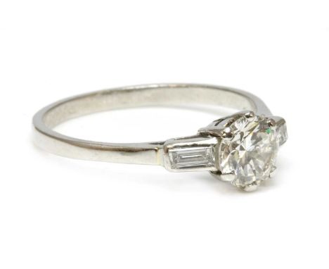 A single stone diamond ring,with diamond set shoulders, with a brilliant cut diamond, estimated as approximately 0.95ct, six 