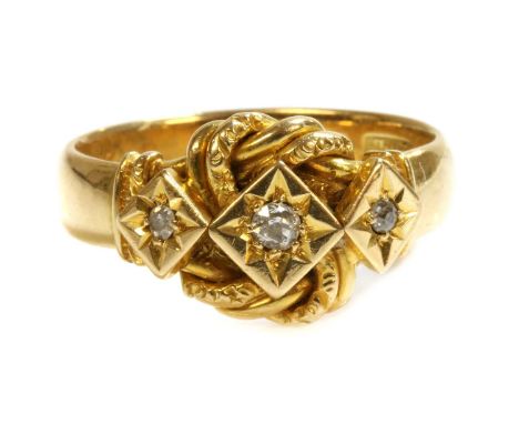 An 18ct gold diamond set knot ring by Henry Williamson Ltd., c.1916, with a two strand plain and twisted wire flattened wool 