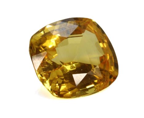 An unmounted cushion cut yellow sapphire,with a stated weight of 5.20ct, together with an unmounted trilliant-shaped mixed cu