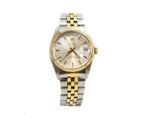 A gentlemen's bi-colour Tudor 'Oyster Prince' day date automatic bracelet watch,no. 9450, with a 35mm case. A silvered dial w