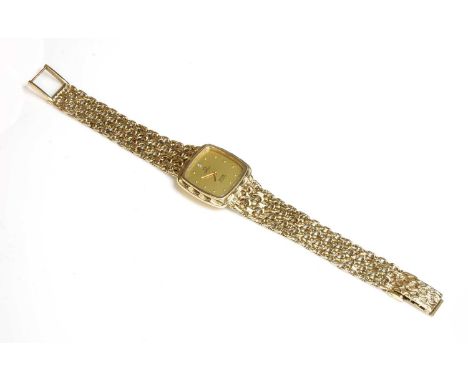 A ladies' 9ct gold Omega 'de Ville' quartz bracelet watch,with a 22.5mm case. A cushion-shaped champagne dial with a diamond 