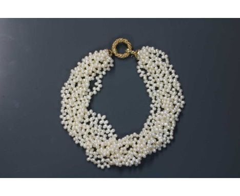 An eight row cultured freshwater pearl torsade necklace,with a 14ct gold hoop clasp/centrepiece. Eight rows of cultured fresh