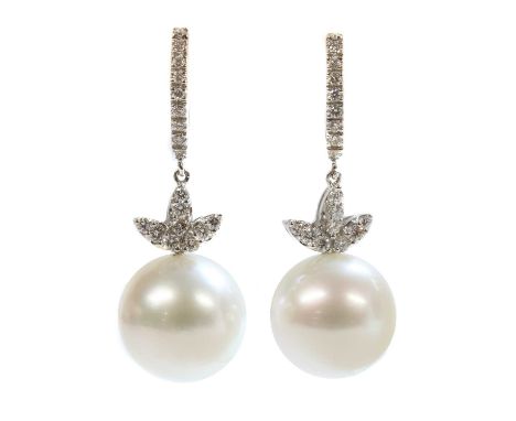 A pair of Italian white gold cultured South Sea pearl and diamond drop earrings,with a 14.70mm cultured South Sea pearl, peg 