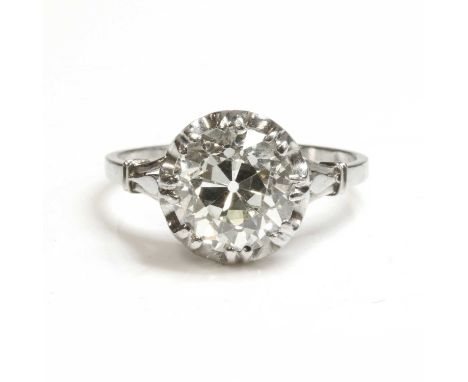 A single stone diamond ring, c.1930,with an old brilliant cut diamond, estimated as approximately 2.90ct, double claw set to 