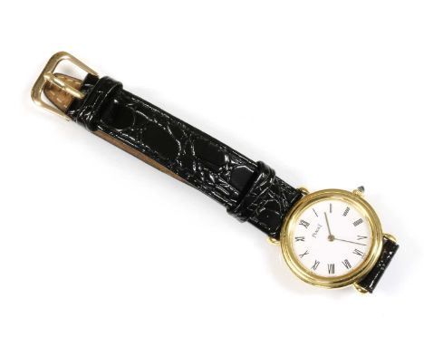 A ladies' 18ct gold Piaget mechanical strap watch, c.1979, with a 26mm case. A white enamel dial with black Roman numerals, s