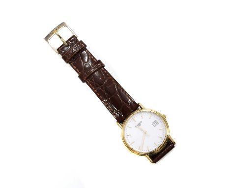 A gentlemen's 18ct gold Tissot 1853 quartz strap watch, c.2004,a circular 33mm case. A white dial, gilt hands and batons, cen
