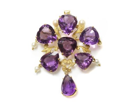 A Continental gold amethyst and cultured pearl brooch/pendant,with an open cluster of six, pear cut amethysts. Open scrolling
