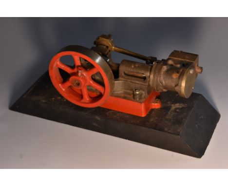 A part-built model of a horizontal steam stationary engine, wooden base, 24.5cm wide overall 