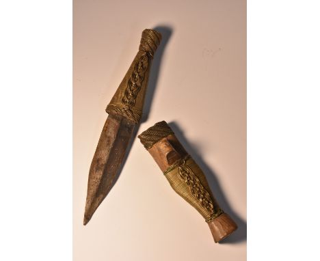 Tribal Art - an African dagger, probably Benin, 8cm pointed double-edged blade, wire bound grip and scabbard, carved suspensi