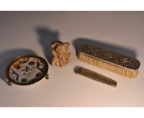 A Chinese silver backed clothes brush, embossed with prunus blossom and song bird, 18cm wide, marked;  a Chinese silver scrib