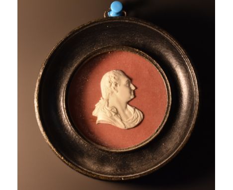 A 19th century bisque relief portrait, of Louis XVI, 4cm x 3cm, circular ebonised frame
