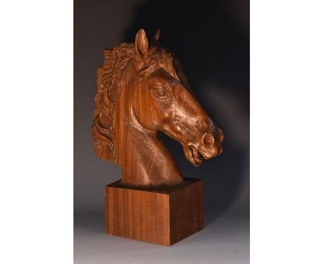 A hardwood desk sculpture, carved as the head of a horse, rectangular base, 28cm high, first half 20th century