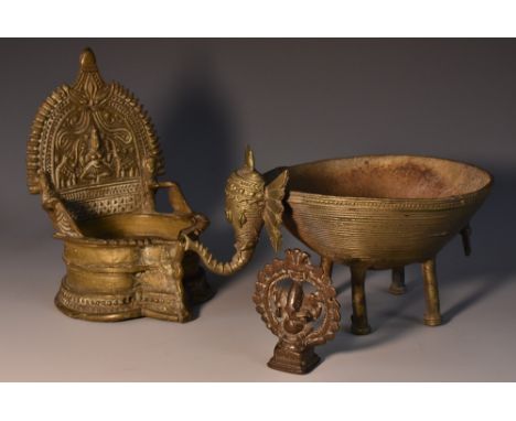 An Indian Gajalakshmi temple oil lamp, of throne form, cast in alternating tones of high and low relief with Lakshmi, Hindu g