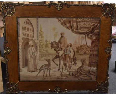 A large 19th century tapestry, worked with Arabs in a Moorish town, 80cm x 100cm, c.1870, parcel-gilt oak frame 