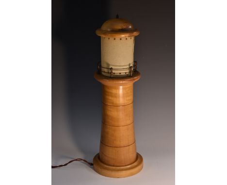 An early 20th century sycamore novelty table lamp, as a lighthouse, domed canopy, 50cm high, fitted for electricity