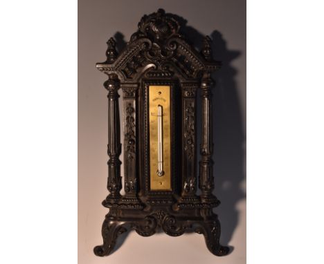 A 19th century French bois durci thermometer, the architectural frame crested by a visor and flanked by reeded columns, mercu