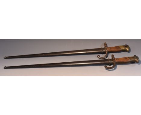 A French Gras bayonet,  triangular steel blade,  dated 1877, steel scabbard with matching numbers 16578;  another, dated 1878