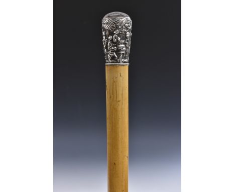 A Chinese silver mounted gentleman's walking cane, the domed pommel embossed with figures amongst leafy bamboo, malacca shaft