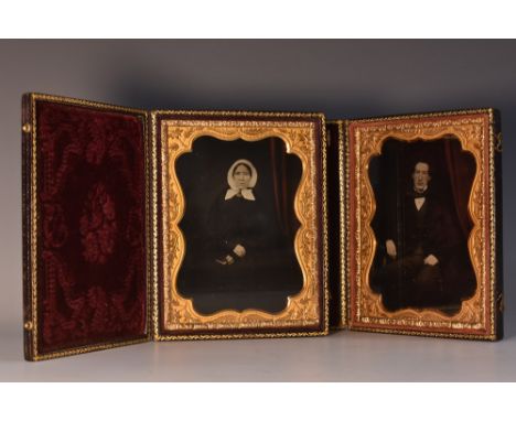 A pair of late 19th century ambrotype, of an American lady and gentleman, folding press moulded cases, 11.5cm x 9cm, c.1860