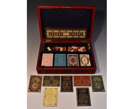A Victorian red morocco leather games compendium, by Edwards & Jones, Regent St, London, hinged cover enclosing a fitted tray