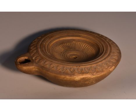 A 19th century Grand Tour terracotta circular oil lamp, after the Ancient Greek, 14.5cm diam 