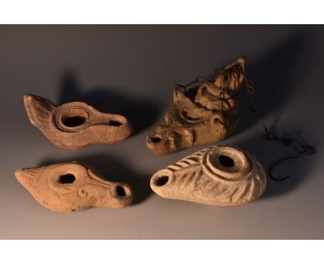 Antiquities - a Greco-Roman Egyptian terracotta tear-shapedc oil lamp, moulded in relief with flutes, angular spout, 10.5cm l
